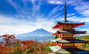 A representative scene of Japan: an autumn landscape under a blue sky with a pagoda in the foreground and Mount Fuji in the background.