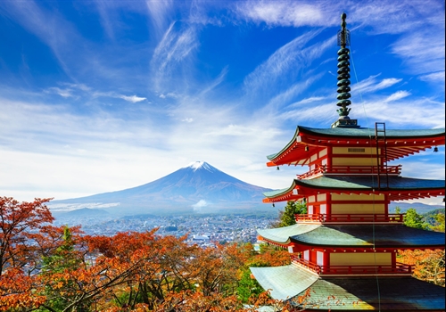 A representative scene of Japan: an autumn landscape under a blue sky with a pagoda in the foreground and Mount Fuji in the background.