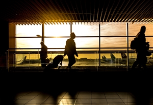 A person at an airport getting ready to depart