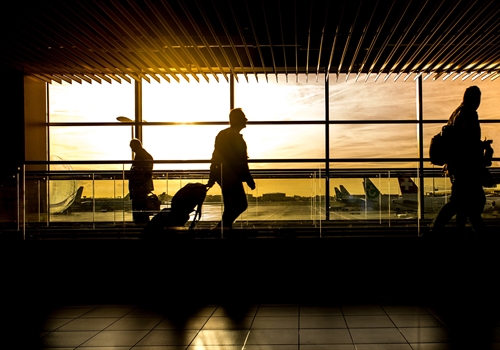 A person at an airport getting ready to depart