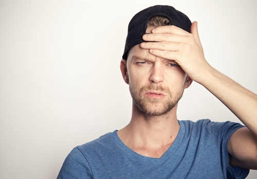 A young man wondering how to prove his covid vaccination status