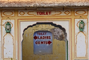 A brightly painted toilet block