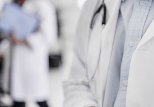 A healthcare professional in a white coat.