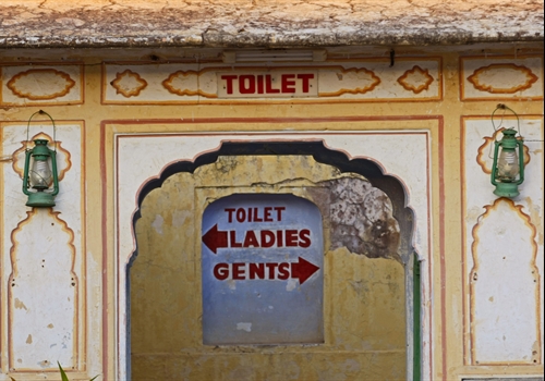 A brightly painted toilet block